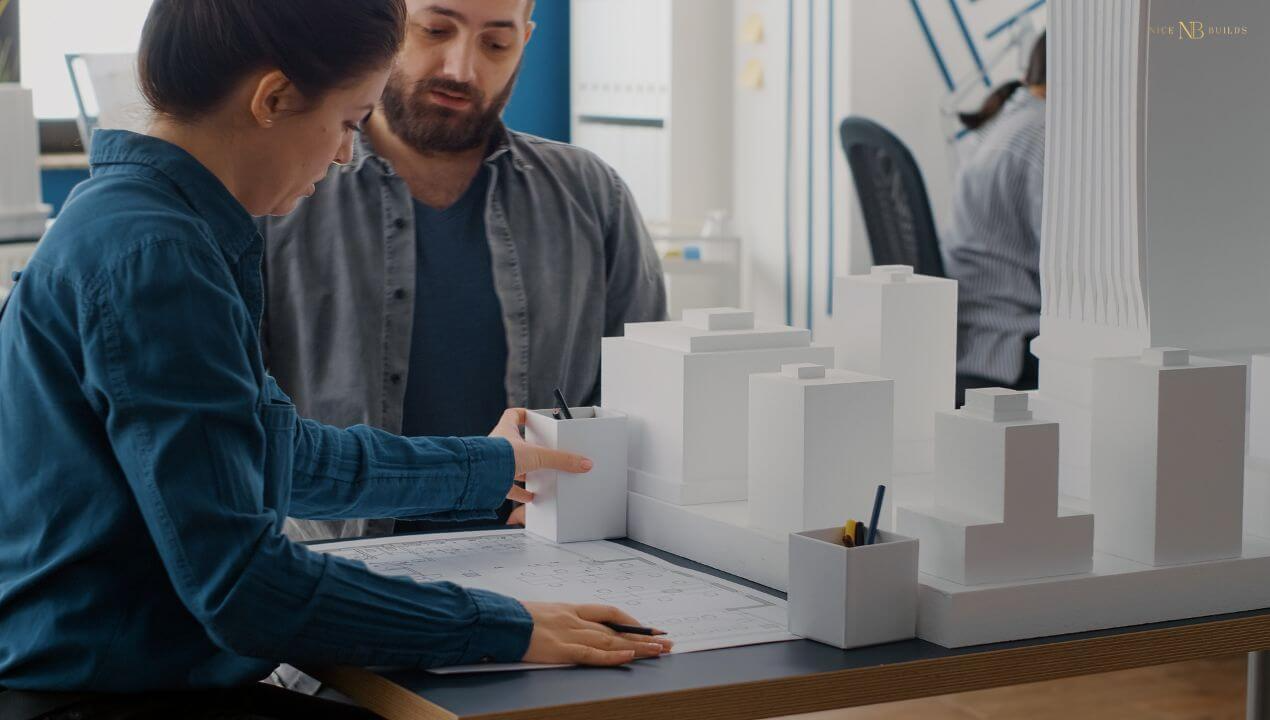 builders preparing the design and construction plan, the first step among all stages of building a house.