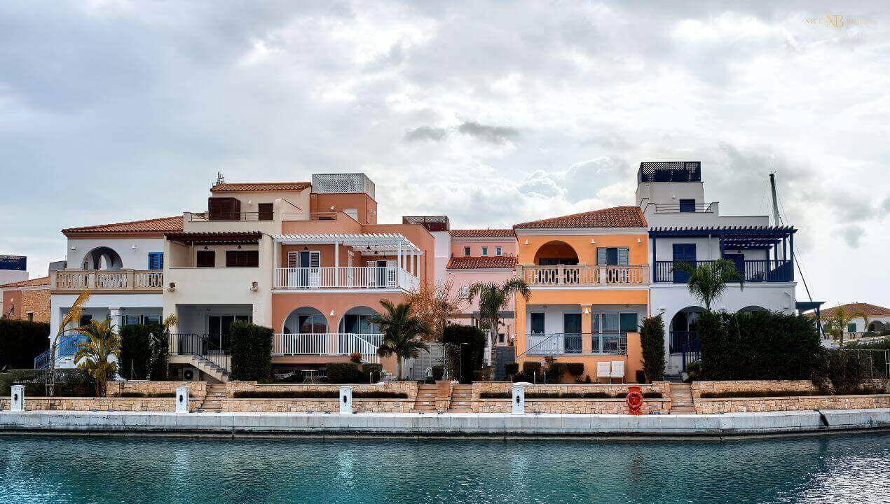 a series of colourful townhouses by the port.