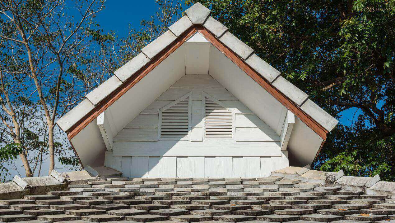 Dutch gable home with metal roofing and textured design