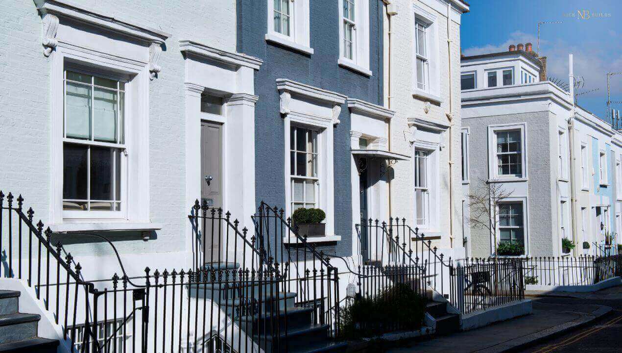 front view of townhouses with white and blue walls.