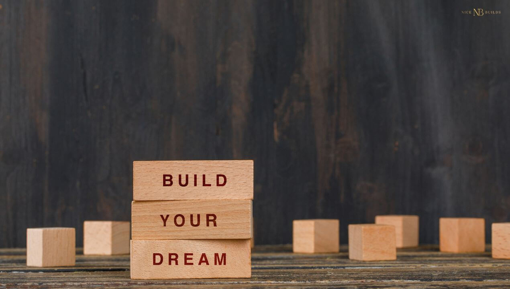 wooden blocks with build your dream written, stacked one after another